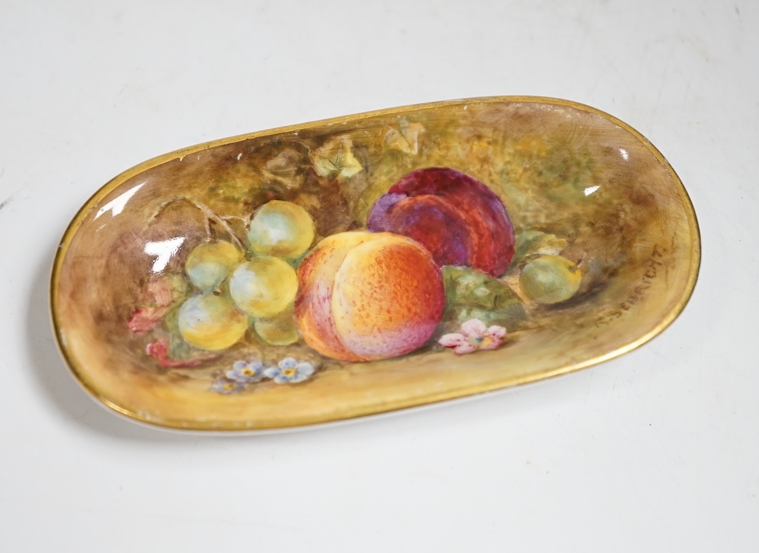A Royal Worcester fruit painted pin dish by Richard Sebright, 10.5cm wide. Condition - good